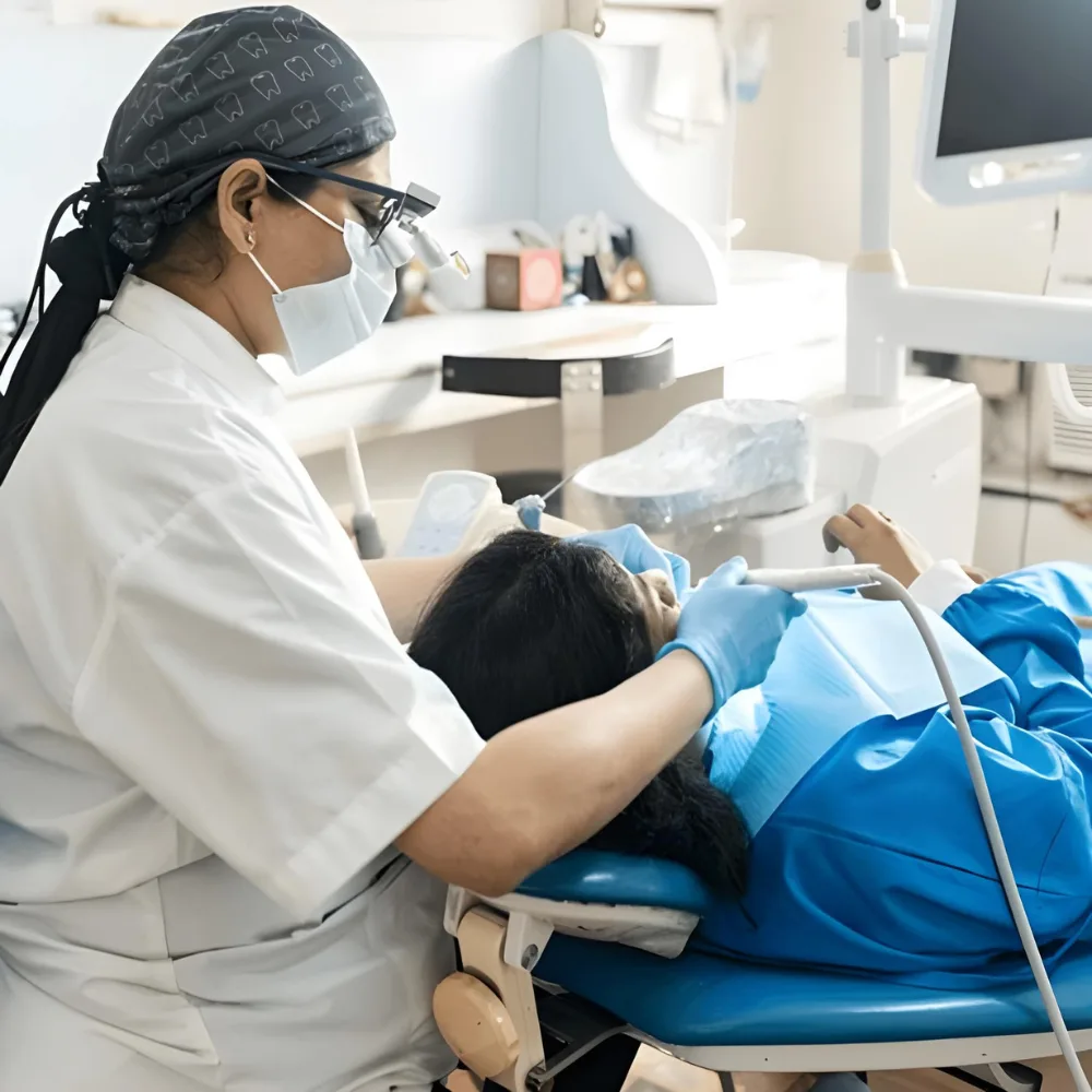 Dr. Khushbu Patel treating a patient at Shayona Dental